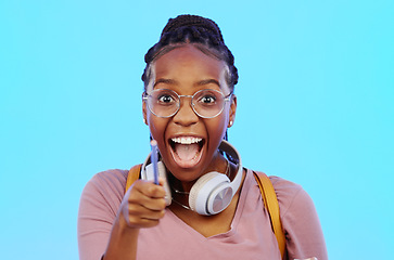 Image showing Wow, thinking and aha with a black woman in studio on a blue background looking thoughtful or surprised. Idea, wonder and eureka with an attractive young female feeling shocked or contemplative