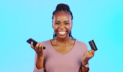 Image showing Black woman, credit card and smartphone for online shopping, retail and payment with lady against a blue studio background. Nigerian female customer, client and shopper with cellphone and ecommerce