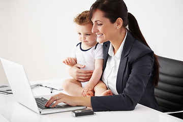 Image showing Remote work, laptop and a mother with care of a baby while working, typing email and doing research. Happy, business and a mom with a computer for entrepreneurship while caring for a child in a house