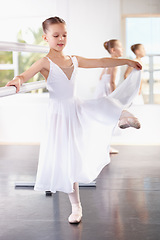 Image showing Young girl, ballet training with dancer at academy, ballerina at practice and dancing at studio. Female child learning to dance in lesson, creativity with fitness and balance, focus and concentration