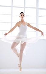 Image showing Dance, ballet and talent with woman in studio for balance, elegant and performance. Artist, theatre and training with female ballerina dancing in class for competition, freedom and commitment