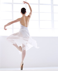 Image showing Dance, ballet and creative with woman in studio for balance, elegant and performance. Artist, theatre and training with female ballerina dancing in class for competition, freedom and commitment