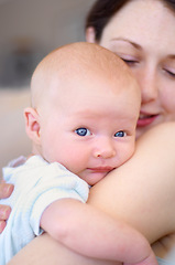 Image showing Portrait, child and mother holding baby, bonding and care together in home. Face, kid and mom carrying newborn, infant or young toddler, playing and enjoying quality time with love, family and happy.