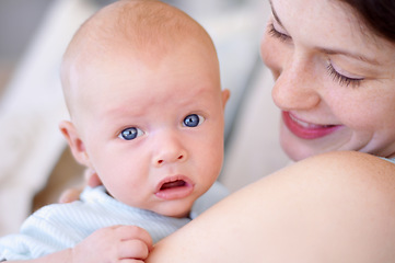 Image showing Portrait, child and mom holding baby, bonding and care together in home. Face, kid and mother carrying newborn, infant or young toddler, playing and enjoying quality time with love, family and happy.