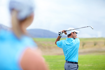 Image showing Drive, man or golfer playing golf for fitness, workout or exercise to swing or drive on green course. Woman blur, person golfing or athlete training in action or sports game driving with club stroke