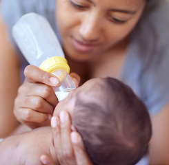 Image showing Mom, baby and feeding milk from bottle for nutrition, health and wellness. Formula, newborn and mother feed child for early childhood development, growth and healthy diet, food and lunch at home.