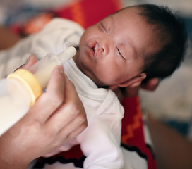 Image showing Baby with cleft lip, milk and mother feeding from bottle for nutrition, health and wellness. Formula, newborn and hand of mom feed child for development, growth or healthy diet, food or lunch at home