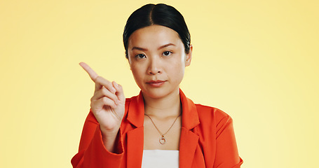 Image showing Face, warning and Asian woman serious, finger and stop against a studio background. Portrait, Japanese female and lady with hand gesture for rejection, unhappy girl and frustrated with disagreement