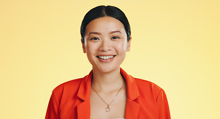 Image showing Asian woman, happy and smile on face for fashion and skincare or beauty on a yellow background. Portrait of a gen z girl model with happiness mockup space and color with a positive mindset and laugh