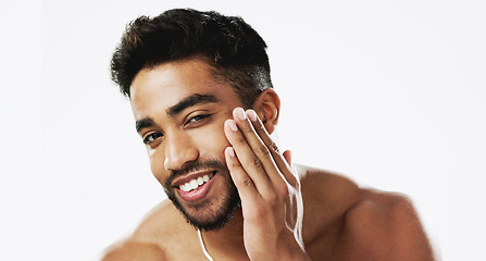 Image showing Skincare, man and hands of face, happy and laughing against white background space. Touch, smile and portrait of Indian male model excited for wellness, beauty and cosmetic care result while isolated