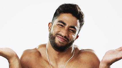 Image showing Uncertain confused and face of man in studio for wellness, skincare and hygiene on white background. Doubt, portrait and indian male model with unsure shrugged shoulders contemplating beauty cosmetic