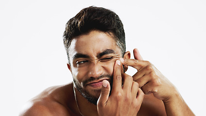 Image showing Pimple pop, Indian man and struggling model doing skincare and wellness routine for acne. Isolated, white background and beauty treatment for dermatology, skin glow and face cleaning for pimples