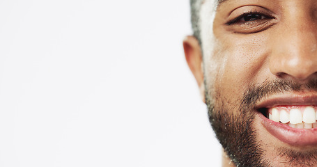 Image showing Face, closeup and man in studio for skincare, happy and laughing against white background. Zoom, smile and portrait of Indian male model excited for wellness, beauty and cosmetic care while isolated