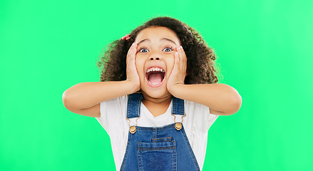 Image showing Shocked, surprise and child hands on face screaming and excited, happy and winning isolated in a studio green screen background. Portrait, young and kid with surprised facial expression due to news