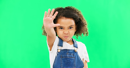 Image showing Angry child, stop and hand on green screen background with emoji and attitude. Black kid portrait in studio with space, mockup and sign for warning, power and protest to reject, defence or decline