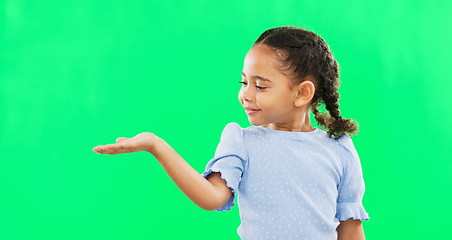 Image showing Green screen, hand gesture and child face of a young girl with mock up showing advertisement or product. Portrait, smile and happiness of a little kid with isolated studio background with mockup