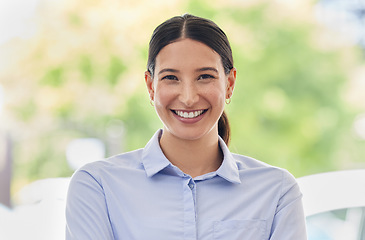 Image showing Portrait, smile and a business woman administrator at work during the day on a green blurred background. Happy, confident and proud with an attractive young female employee standing outdoor alone