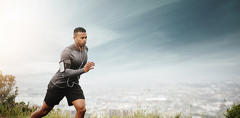 Image showing Man, running and space for fitness with cityscape for exercise, wellness or music with mockup for health. African male runner listening to audio for focus, workout and nature outdoor with mock up sky