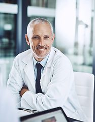 Image showing Healthcare, portrait and senior doctor at desk with smile, pride and hospital management for support in clinic. Health care boss, happiness and medicine, happy man medical professional in office.