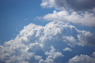 Image showing Nature, space and heaven with clouds in blue sky for environment, peace and climate. Sunshine, mockup and dream with fluffy cloudscape in ozone air for freedom, pattern and weather meteorology