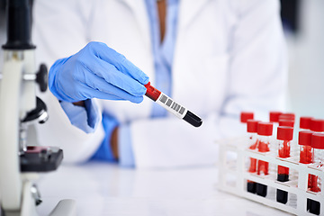 Image showing Hand, blood and science with a doctor in a laboratory for dna research or innovation using a sample. Healthcare, medical and investigation with a scientist working in a lab for genetic analysis