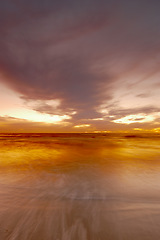 Image showing Nature, ocean and clouds with sunset at beach for environment, peace and landscape mockup. Summer, sunshine and sunrise with wave on horizon for travel destination, reflection and seaside vacation