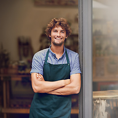 Image showing Retail, arms crossed and portrait of man at restaurant for small business, coffee shop and waiter. Entrepreneur, happy and smile with male barista at front door of cafe for diner and food industry