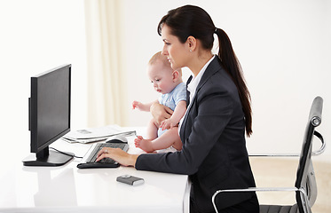 Image showing Remote work, businesswoman with her baby and typing on keyboard with pc at her desk in a office. Technology, commitment and mother with her child writing an email with her computer at her home