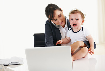 Image showing Woman, home office and phone call with kid, laptop and care with talk, reading and multitasking at desk. Mother, baby boy and cellphone for networking, crying and remote work at pc in family house