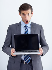 Image showing Laptop, mockup and shock with portrait of man in studio for website, email and administration. Wow, news and technology with male employee in white background for corporate, internet or networking