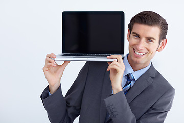 Image showing Laptop, mockup and happy business man portrait holding screen space on studio white background. Smile, display and face of male person with computer copy space for advertising, marketing or branding