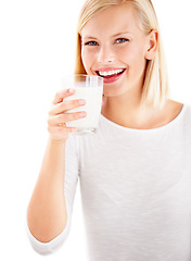 Image showing Portrait, milk and smile with a woman drinking from a glass in studio isolated on a white background. Health, nutrition and calcium with a happy young female enjoying a drink for vitamins or minerals