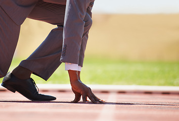 Image showing Race track, start and man in a suit for sport, running and fitness, cardio and speed practice. Starting line, ready and formal male sports runner at a stadium for challenge, performance and workout