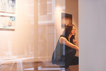 Image showing Museum, art and a woman in a painting gallery, looking at photography exhibition in creative appreciation. Artwork, design and culture with an attractive young female at an expo or artistic exhibit