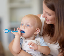 Image showing Mom, baby and feeding food, breakfast and eating for healthy nutrition in home. Happy mother, newborn and feed hungry child, infant or toddler meal with a spoon for growth, development and wellness.