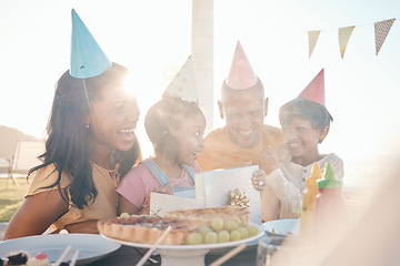 Image showing Family, love and happy birthday for girl with wow gift, bonding and laughing, excited and having fun outdoors. Parents, children and kid party outside for cheerful female child with surprise present