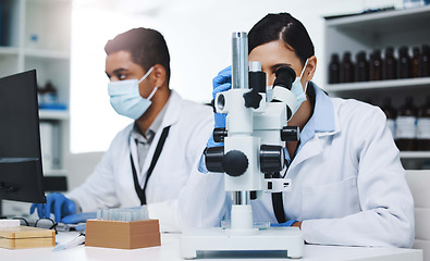 Image showing Science, laboratory and team of scientists with microscope for research, medical analysis and lab test. Healthcare, biotechnology and man and woman with equipment for sample, experiment and virus