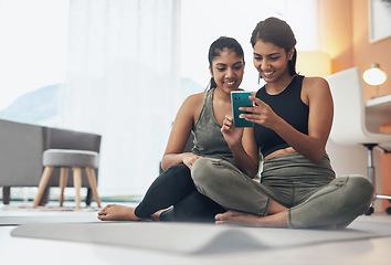 Image showing Exercise, phone and women together at home with internet connection and social media. Indian sisters or female friends in lounge with smartphone for online class, chat or fitness workout with partner