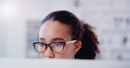 Image showing Focus, face and computer with business woman in office for website, planning and reading online. Designer, technology and internet research with female employee for digital, creative and networking