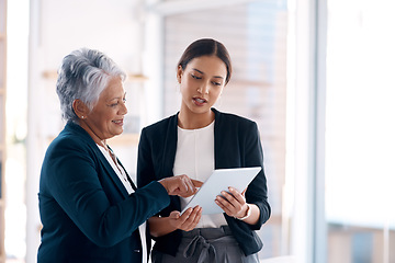 Image showing Collaboration, mentor and business women with tablet for talking, cooperation or planning. Technology, teamwork and happy senior manager with female analyst for intern training or coaching in office