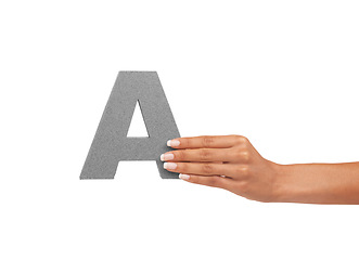 Image showing Alphabet, uppercase and a hand with capital letter A for learning, advertising or font. A woman show sign, character or icon for communication, typo and grammar isolated on a studio white background