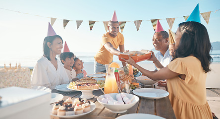 Image showing Birthday, parents and children with food by beach for event, celebration and party outdoors. Family, social gathering and mother, father with kids at picnic with cake, presents and eating together