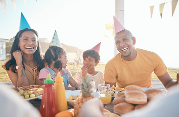 Image showing Happy parents and children at birthday in park for event, celebration and party outdoors together. Family, social gathering and mother, father with kids at picnic with cake, presents and eating food