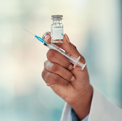 Image showing Healthcare, close hand of doctor with syringe and covid vaccine at a hospital. Medication, treatment and nurse or surgeon hands with medical injection needle for health wellness for corona virus