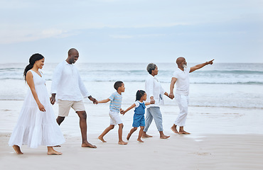 Image showing Family walk on beach sand, holding hands and generations, tropical vacation in Mexico, travel and trust outdoor. Grandparents, parents and kids, happy people with adventure and tourism with sea view