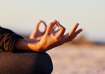 Image showing Hands closeup, yoga and beach with woman, lotus and peace of mind in summer sunshine on sand. Girl, zen meditation and mindfulness for health, wellness or exercise by ocean, outdoor or chakra balance