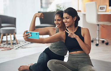 Image showing Exercise, peace sign and selfie of women together at home for social media memory or post. Indian sisters or female friends with a photo for influencer update, fitness motivation or muscle results