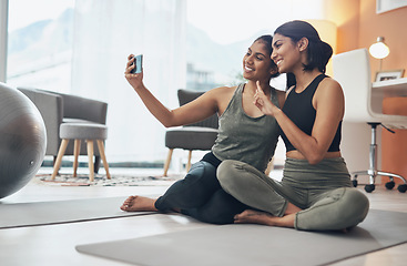 Image showing Exercise, peace sign and selfie of women together at home for social media blog post. Indian sisters, female friends and in lounge for online influencer update, fitness photograph and happy emoji