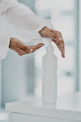 Image showing Hand sanitizer bottle, doctor hands and Covid rules with health policy, disinfection and safety from virus. Medical person, healthcare compliance for corona and disinfecting closeup with hygiene