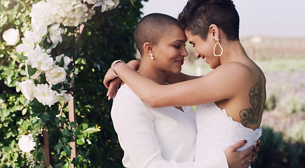 Image showing love, hug and kiss with lesbian couple at wedding for celebration, gay and pride. Smile, spring and happiness with women at marriage event in garden for partner commitment, lgbtq and freedom